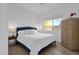 Airy bedroom with blue accents, hardwood flooring, and natural light at 6448 E Hearn Rd, Scottsdale, AZ 85254