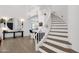 Grand entryway with spiral staircase and views into the home at 6448 E Hearn Rd, Scottsdale, AZ 85254