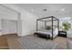 Spacious main bedroom with canopy bed frame and accent rug at 6448 E Hearn Rd, Scottsdale, AZ 85254