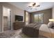Bedroom with furniture, carpet, ceiling fan, and natural light at 6959 E Red Hawk Cir, Mesa, AZ 85207