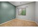 Bedroom featuring a serene color scheme, carpeted floors, and a window at 6959 E Red Hawk Cir, Mesa, AZ 85207