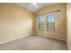 Bedroom with vaulted ceilings, a ceiling fan, neutral walls, and carpet flooring at 6959 E Red Hawk Cir, Mesa, AZ 85207