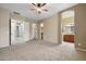 Spacious main bedroom features an en-suite bathroom and ample closet space at 6959 E Red Hawk Cir, Mesa, AZ 85207