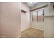 Walk-in closet with carpet flooring and natural light at 6959 E Red Hawk Cir, Mesa, AZ 85207