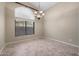 Dining room featuring large window, tile floors, and modern chandelier at 6959 E Red Hawk Cir, Mesa, AZ 85207