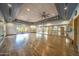 Spacious dance studio with hardwood floors, mirrors, and natural light at 6959 E Red Hawk Cir, Mesa, AZ 85207
