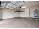 Garage with ceiling storage racks and epoxy floors at 6959 E Red Hawk Cir, Mesa, AZ 85207