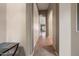 Hallway featuring tile flooring, architectural arches, and neutral wall color at 6959 E Red Hawk Cir, Mesa, AZ 85207