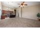 Open concept living space features tile flooring and easy access to kitchen and backyard at 6959 E Red Hawk Cir, Mesa, AZ 85207