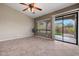 Open concept living space features tile flooring and easy access to backyard through sliding glass door at 6959 E Red Hawk Cir, Mesa, AZ 85207