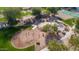 Aerial view of playground, splashpad, and swing set at 6959 E Red Hawk Cir, Mesa, AZ 85207