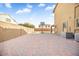 Spacious brick-paved backyard featuring a basketball hoop, perfect for outdoor activities and entertaining at 8615 S 45Th Gln, Laveen, AZ 85339