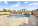 Beautiful backyard pool with travertine decking, mature landscaping, and perimeter block wall at 8615 S 45Th Gln, Laveen, AZ 85339