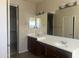 Primary bathroom with dual sinks, framed mirror, and ample counter space at 8615 S 45Th Gln, Laveen, AZ 85339