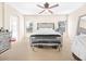 Bright bedroom with carpet, mirrored bed frame, bench, side tables and lots of light at 8615 S 45Th Gln, Laveen, AZ 85339