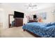 Cozy bedroom featuring wood furniture, carpet, and a comfortable queen size bed at 8615 S 45Th Gln, Laveen, AZ 85339