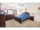 Comfortable bedroom featuring a ceiling fan, window, and classic wood furnishings at 8615 S 45Th Gln, Laveen, AZ 85339