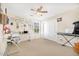Bedroom features a music keyboard, desk, and natural light from a large window at 8615 S 45Th Gln, Laveen, AZ 85339