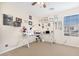 Bedroom features a work desk, ample lighting, and a window with natural light at 8615 S 45Th Gln, Laveen, AZ 85339
