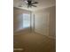 Cozy bedroom featuring neutral carpet, double door closet, and natural lighting at 8615 S 45Th Gln, Laveen, AZ 85339