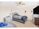 Comfortable bedroom with a stylish bed and a ceiling fan for optimal air circulation at 8615 S 45Th Gln, Laveen, AZ 85339