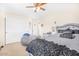 Well-lit bedroom with a queen-size bed, plush beanbag chair, and built in wardrobe at 8615 S 45Th Gln, Laveen, AZ 85339