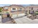 Beautiful two-story home with a tile roof, three-car garage, and desert landscaping at 8615 S 45Th Gln, Laveen, AZ 85339