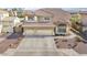 Charming two-story home with a well-manicured front yard and a three-car garage at 8615 S 45Th Gln, Laveen, AZ 85339