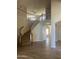 Elegant home foyer with a staircase and tile flooring, leading to the upper level at 8615 S 45Th Gln, Laveen, AZ 85339