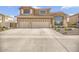 Charming two-story home featuring a spacious three car garage and well-maintained landscaping at 8615 S 45Th Gln, Laveen, AZ 85339