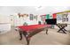 Game room featuring a pool table, foosball table, and eclectic wall decor at 8615 S 45Th Gln, Laveen, AZ 85339
