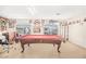 Spacious game room featuring a pool table and bright, natural light from the windows at 8615 S 45Th Gln, Laveen, AZ 85339