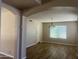 Open-concept living room with tile floors and natural light, creating a welcoming space at 8615 S 45Th Gln, Laveen, AZ 85339
