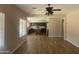 Open-concept living space with tile floors flows into the kitchen creating an inviting atmosphere at 8615 S 45Th Gln, Laveen, AZ 85339