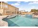 Gorgeous backyard pool and spa with a covered patio and well-manicured lawn at 8615 S 45Th Gln, Laveen, AZ 85339