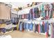 Well-organized walk-in closet with multiple rods and shelves for optimal storage at 8615 S 45Th Gln, Laveen, AZ 85339