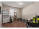 This bedroom could be an office or flex space; features include a window and shelving at 8749 W Clarendon Ave, Phoenix, AZ 85037