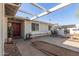 Covered patio with furniture and view of the front entry at 8749 W Clarendon Ave, Phoenix, AZ 85037