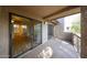 Large balcony showcasing the view of the interior through sliding glass doors and the surrounding landscape at 9450 N 94Th Pl # 215, Scottsdale, AZ 85258
