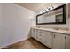 Bathroom with dual sink vanity and ample storage at 9450 N 94Th Pl # 215, Scottsdale, AZ 85258