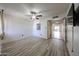 Minimalist bedroom featuring light wood floors, a ceiling fan and a closet at 9450 N 94Th Pl # 215, Scottsdale, AZ 85258