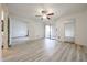 Bedroom with new floors, ceiling fan, access to the patio, and views to other rooms at 9450 N 94Th Pl # 215, Scottsdale, AZ 85258