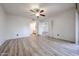 Bedroom with new floors and access to bathroom and other rooms via double doors at 9450 N 94Th Pl # 215, Scottsdale, AZ 85258
