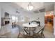 Bright dining area with stylish seating flows seamlessly into the living room and adjacent kitchen at 9450 N 94Th Pl # 215, Scottsdale, AZ 85258