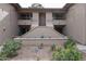 Inviting two-story condo building with desert landscaping and covered balconies in a desirable community at 9450 N 94Th Pl # 215, Scottsdale, AZ 85258