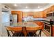 Bright kitchen with granite countertops, stainless steel appliances, and a central island at 9450 N 94Th Pl # 215, Scottsdale, AZ 85258