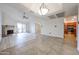Bright living area featuring a fireplace, modern light fixture, and dining area at 9450 N 94Th Pl # 215, Scottsdale, AZ 85258
