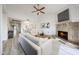 Cozy living room features a fireplace, modern decor, and an open floor plan leading to the dining area at 9450 N 94Th Pl # 215, Scottsdale, AZ 85258