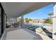Inviting outdoor covered patio overlooks the sparkling pool, spa and backyard at 24437 N 94Th Ave, Peoria, AZ 85383