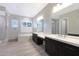 Stylish bathroom includes double sink vanity, a tub and a separate glass enclosed shower at 24437 N 94Th Ave, Peoria, AZ 85383